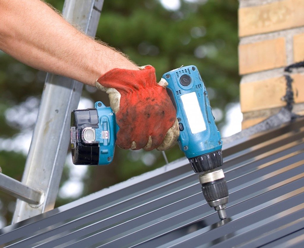 using power drill on a roof