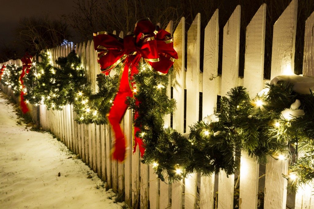 White wooden fence with Christmas decorations