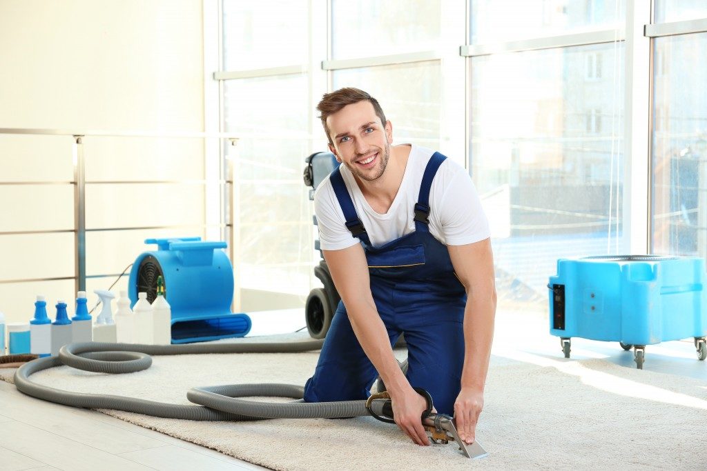 professional house cleaner cleaning carpets