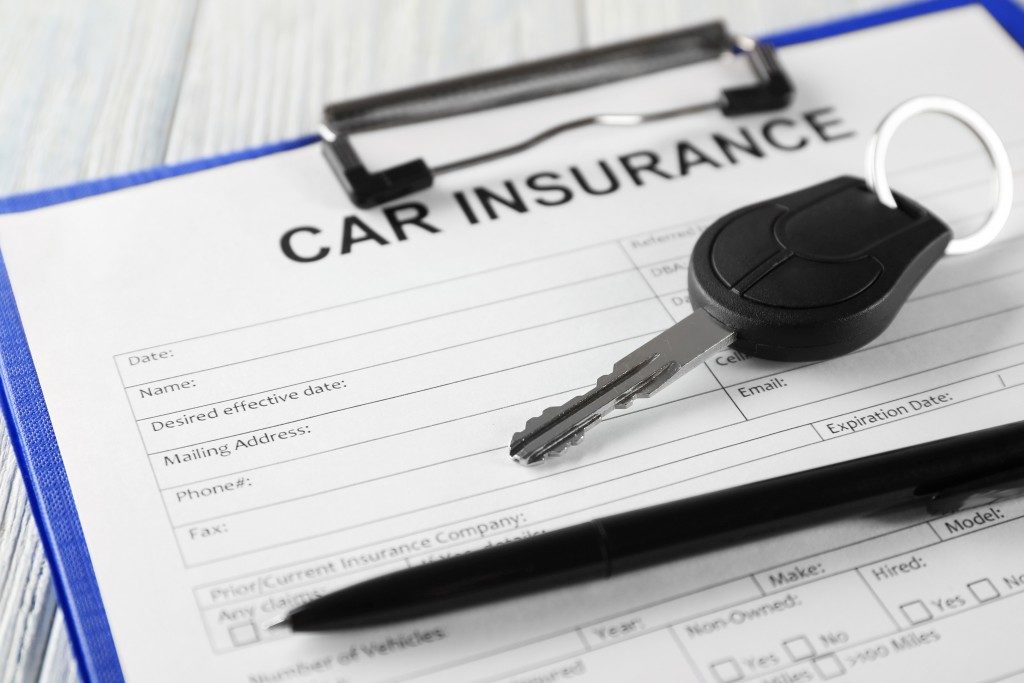 Car keys and insurance form