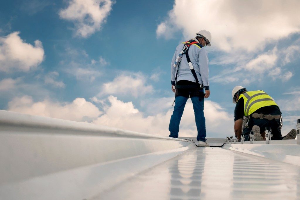 workers repairing a commercial roof
