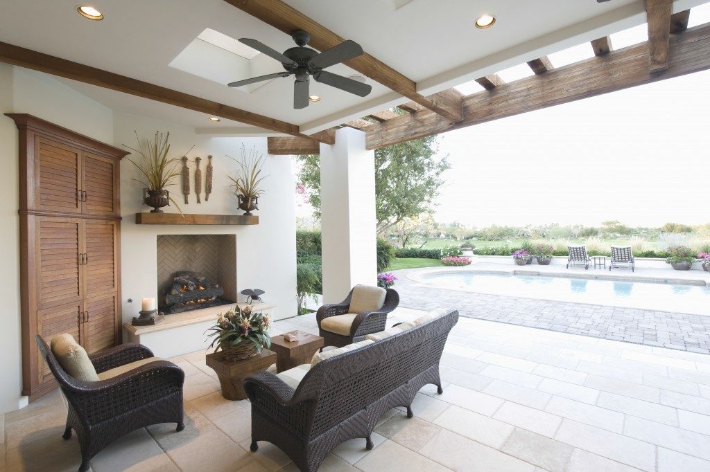 Swimming pool with seating area in outdoor room