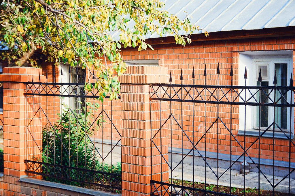 Metal fence with brick columns