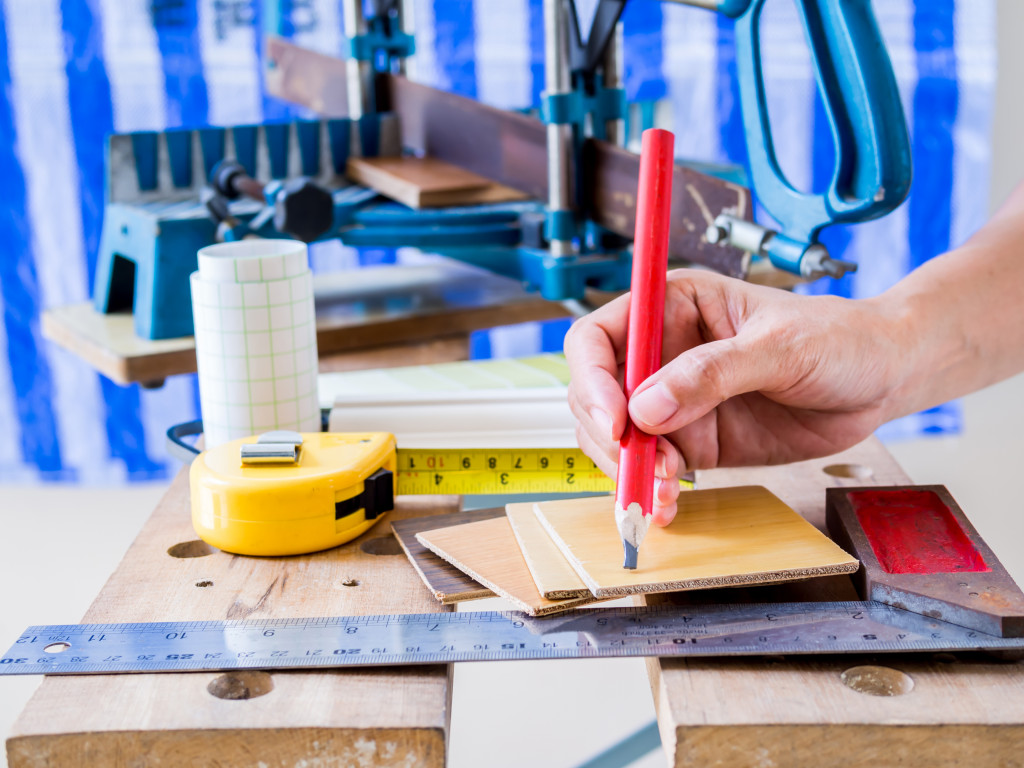 A man measuring for a home renovation.