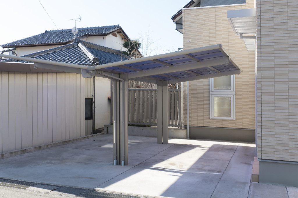 A carport in a residential area providing shade