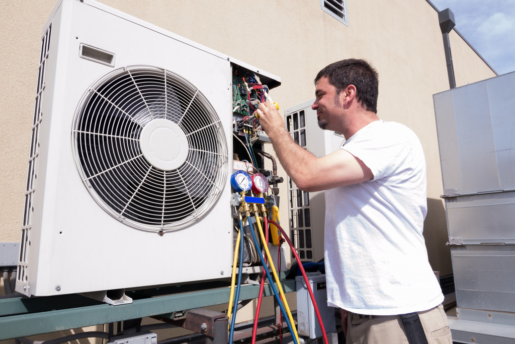 A technician repairing an HVAC unit