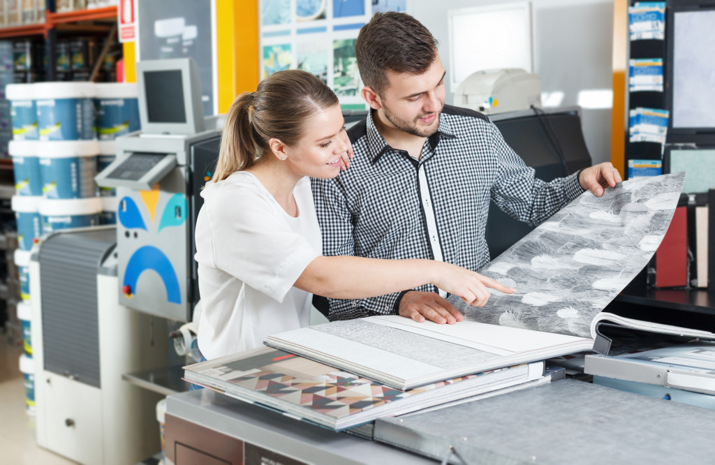 couple looking at brochure for home renovation