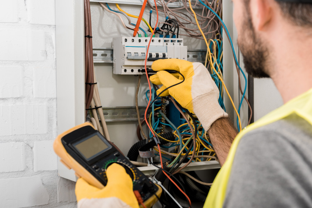 electrician checking electrical box