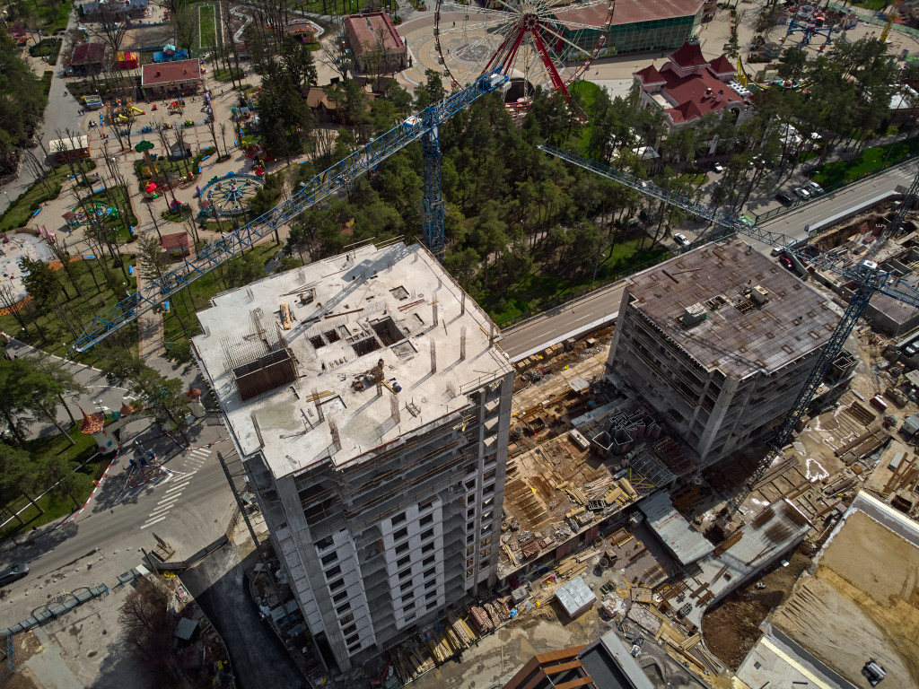Aerial view of a building under construction in a city.