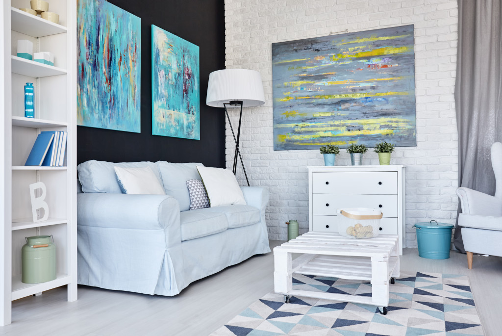 creative living room with blue paintings