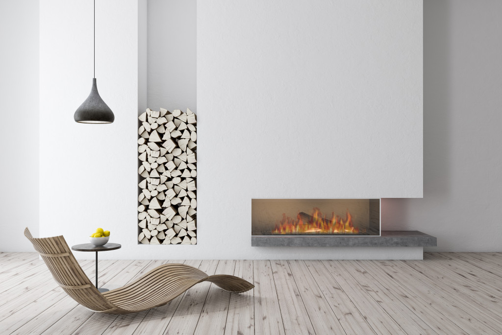 A statement piece chair in front of a fireplace