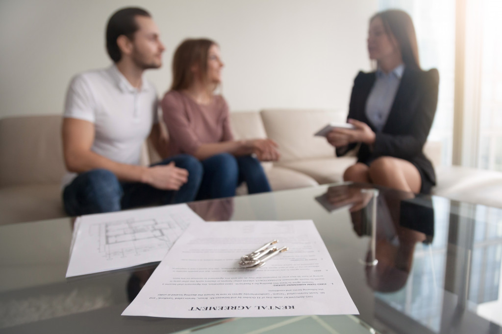 house plan budget being discussed by agent and couple