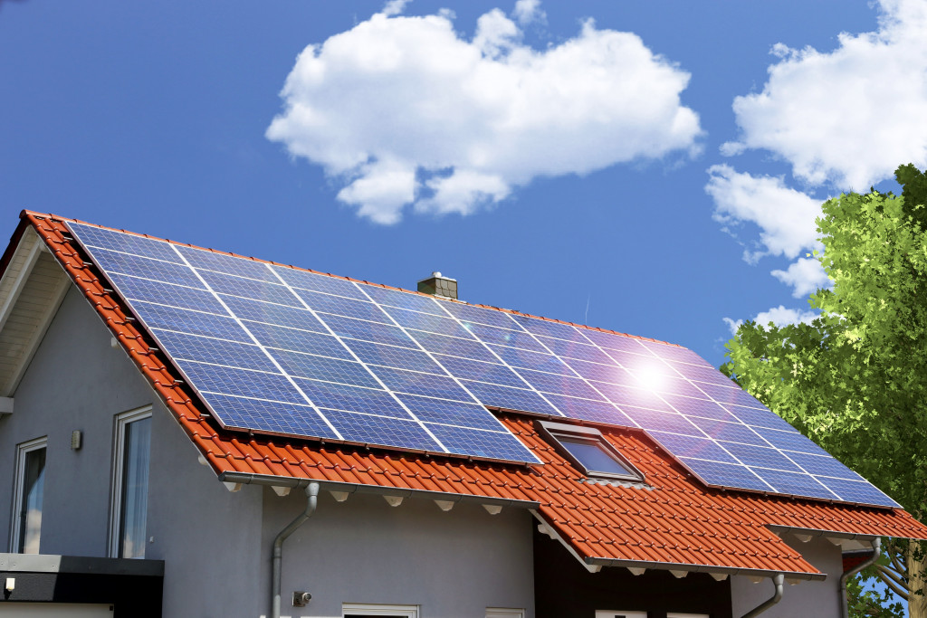 a house roof with many solar panels