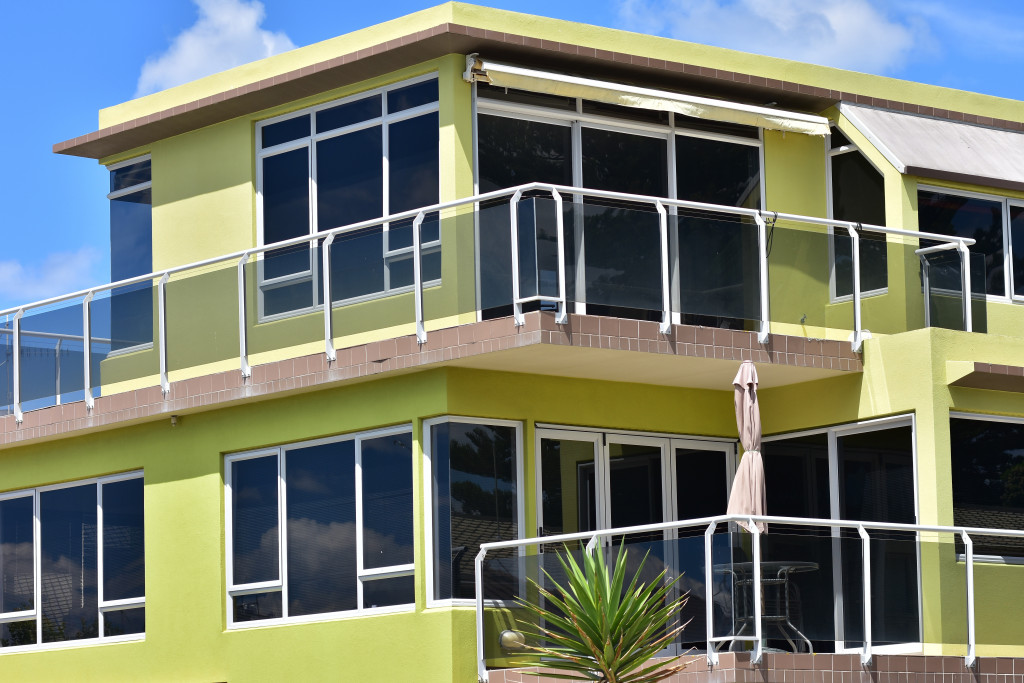 a green house with beautiful window works 